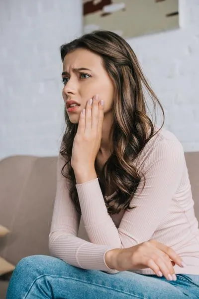 woman in pain due to her toothache
