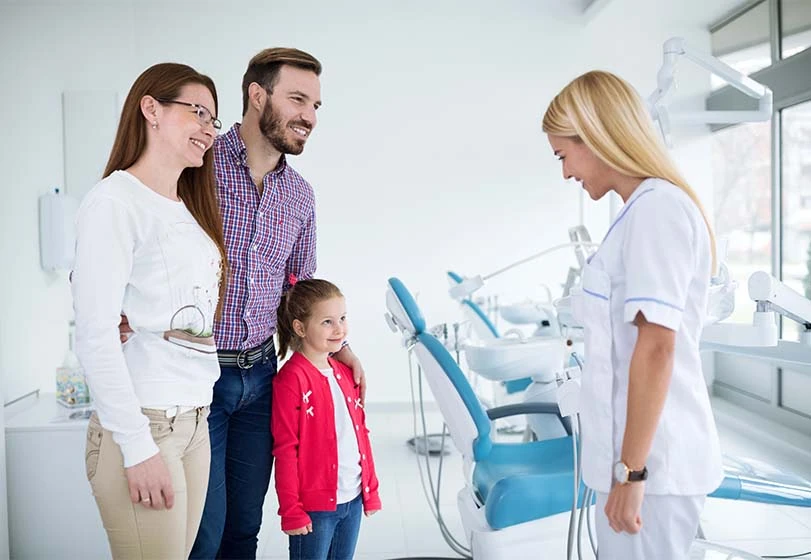 Dentist speaking to family at Smile Studio Dentistry in Upland, CA
